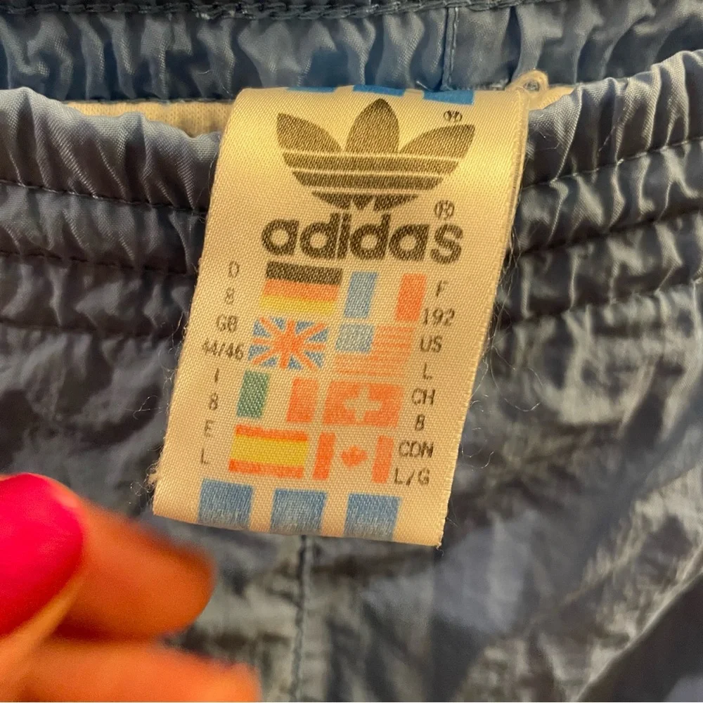 Vintage 90s Adidas Nylon Blue Men's Track Pants with All Countries Flag Tag - L